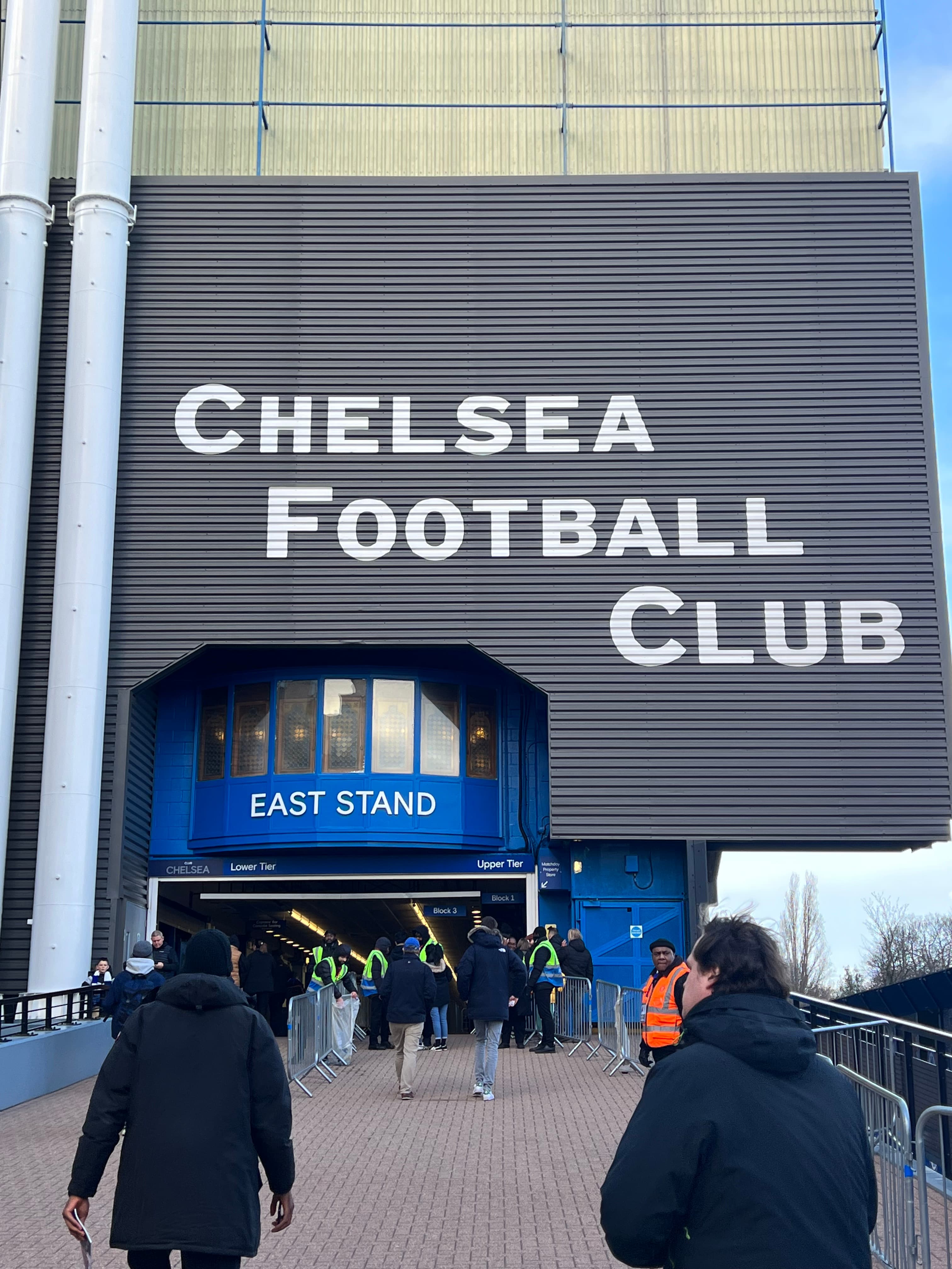 Stamford Bridge East Stand entrance Chelsea Football Club sign fans arriving matchday Premier League London