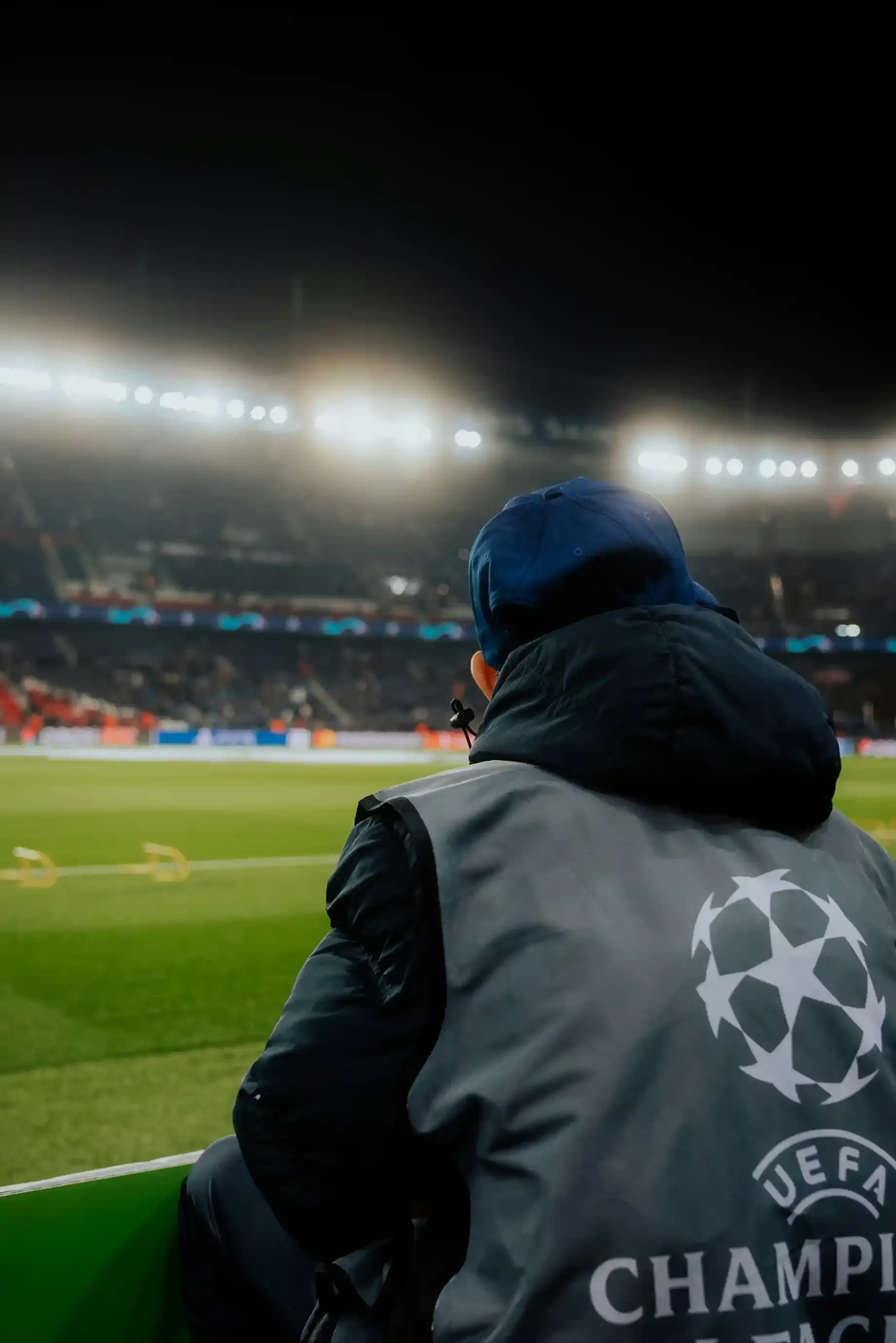 steward with champions league clothes watching a game